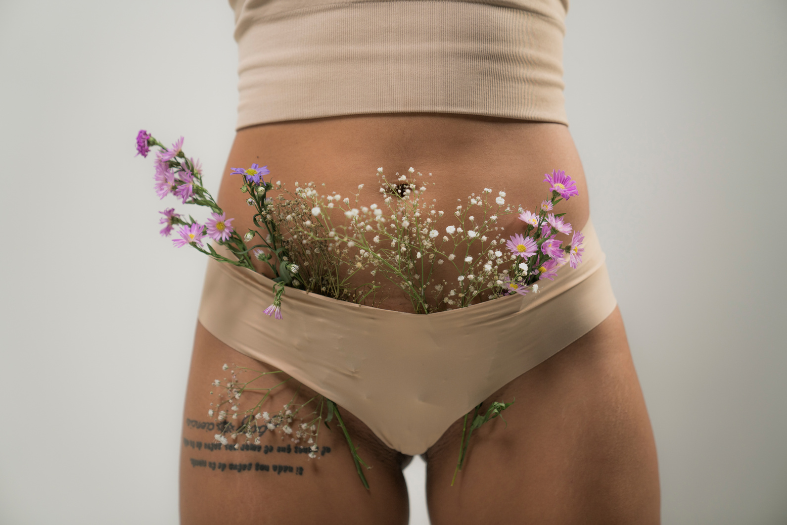 A Woman Wearing Brown Panty with Flowers
