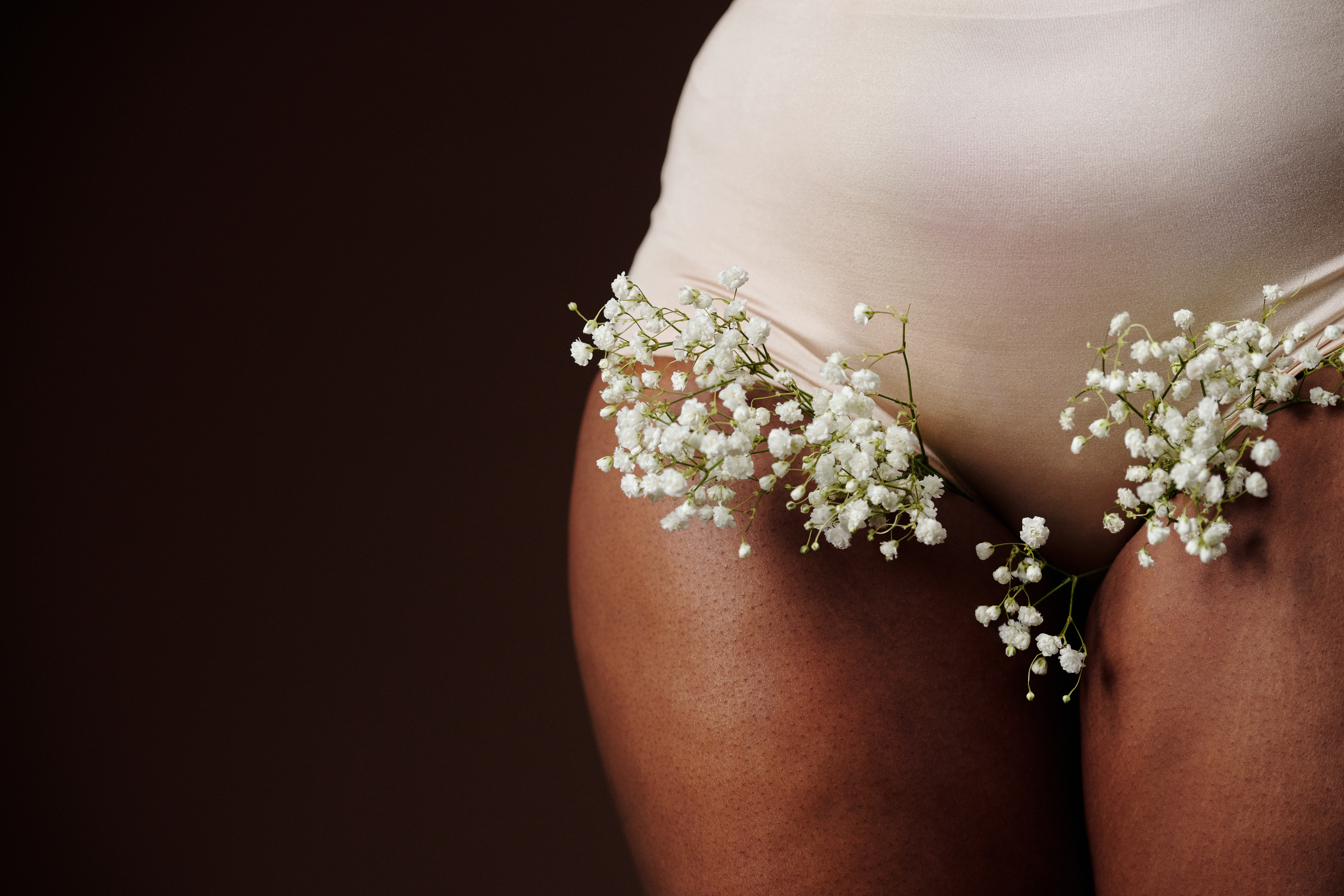White Flowers on a Person Wearing White Underwear