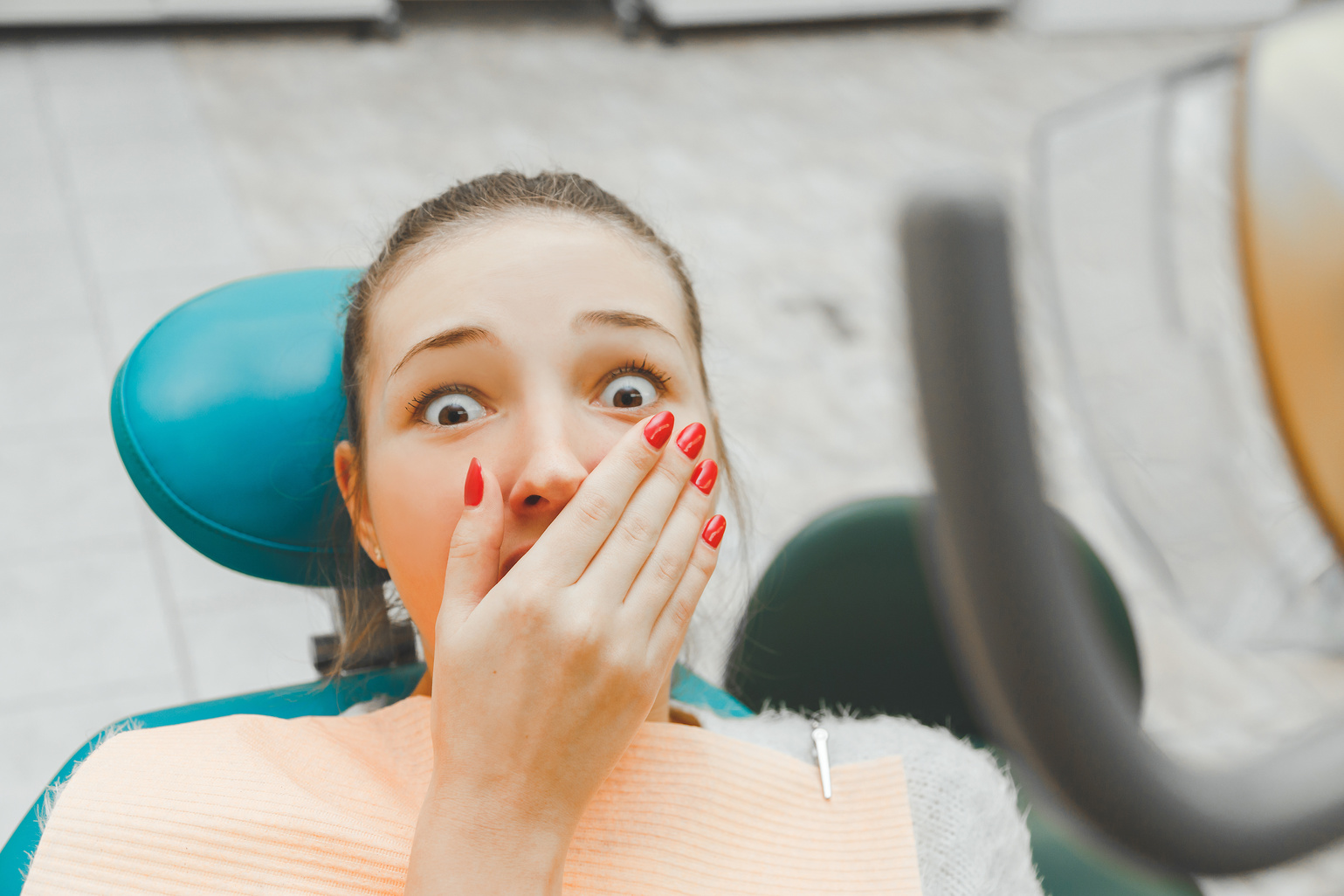 Young Beautiful Girl Feel the Fear of Dental Instruments